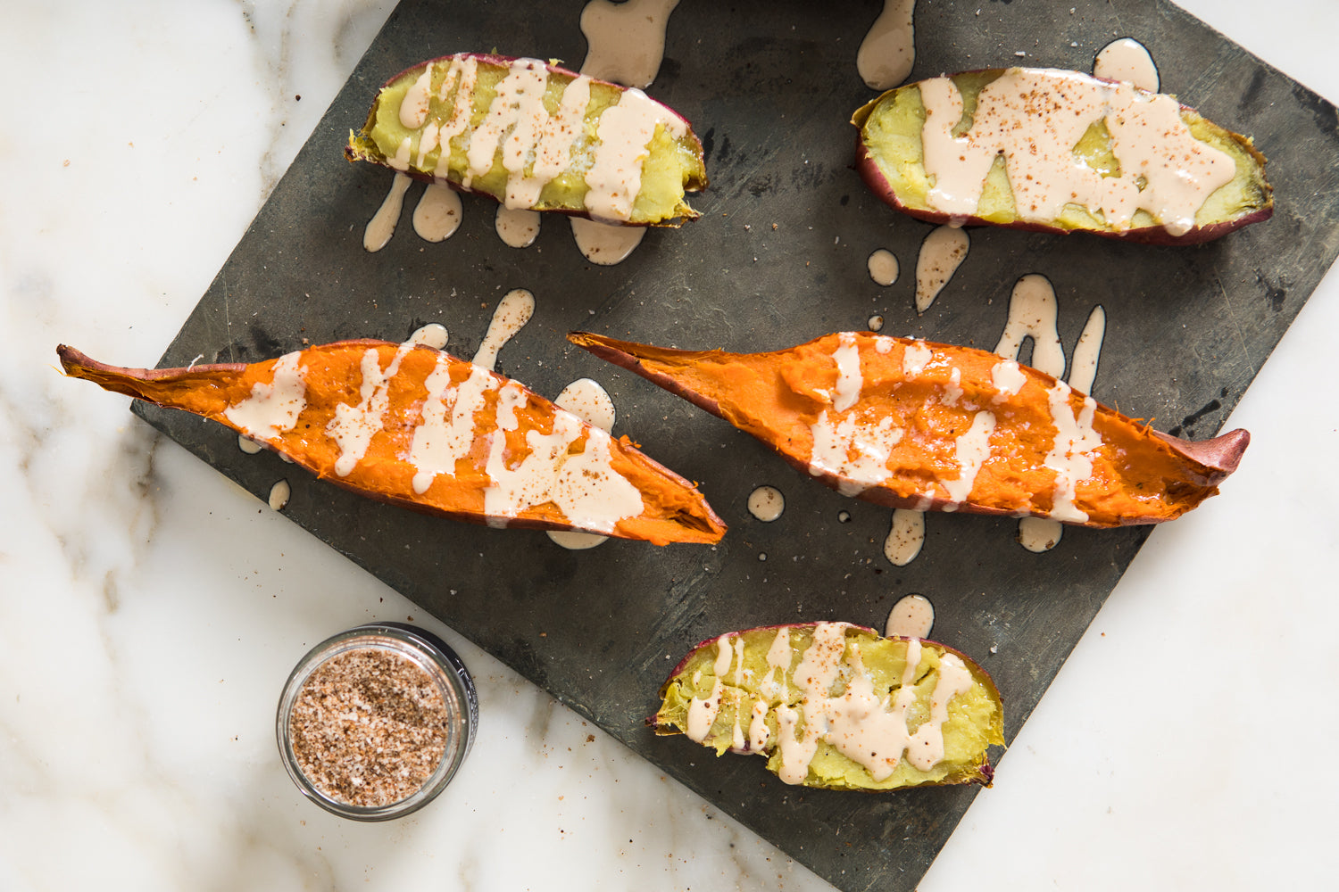 Sweet Potato Boats with Infused Black Garlic Tahini Sauce