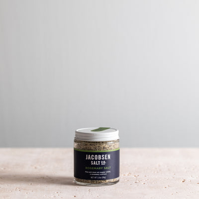 A 3.5 oz jar of Jacobsen Infused Rosemary Salt.