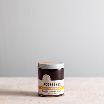 8.62 ounce jar of Jacobsen Raw Carrot Flower Honey