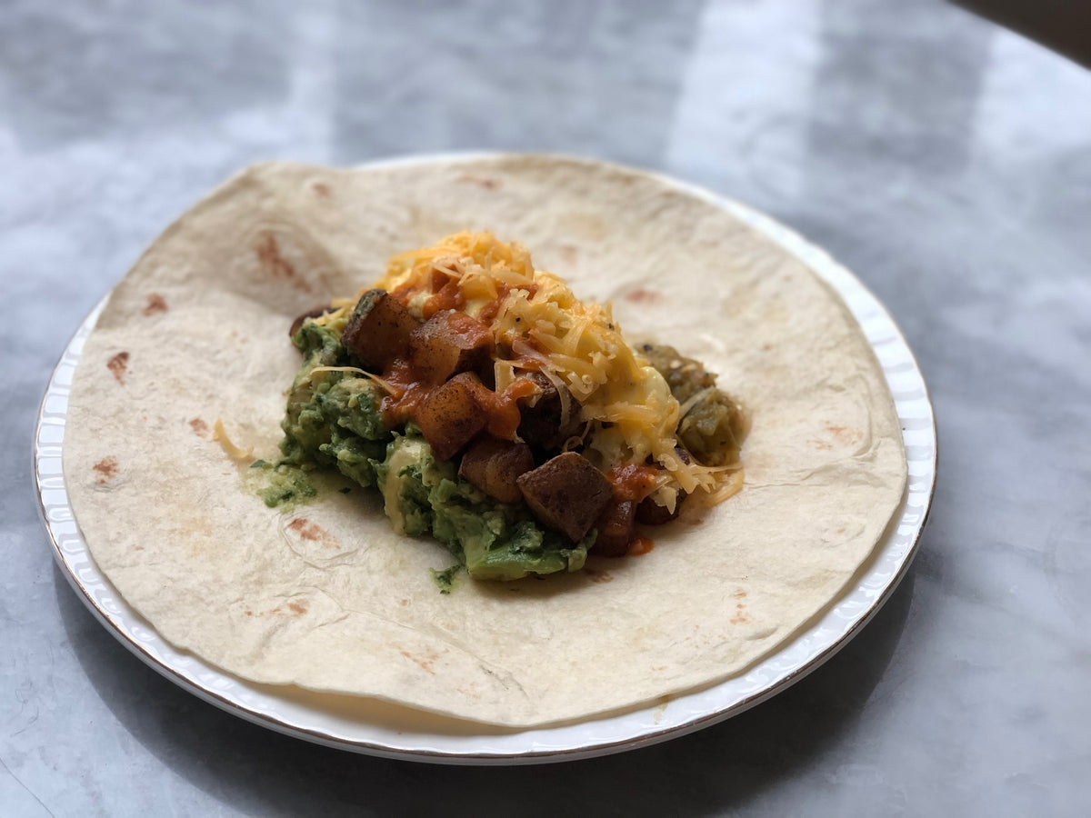 An open breakfast burrito.