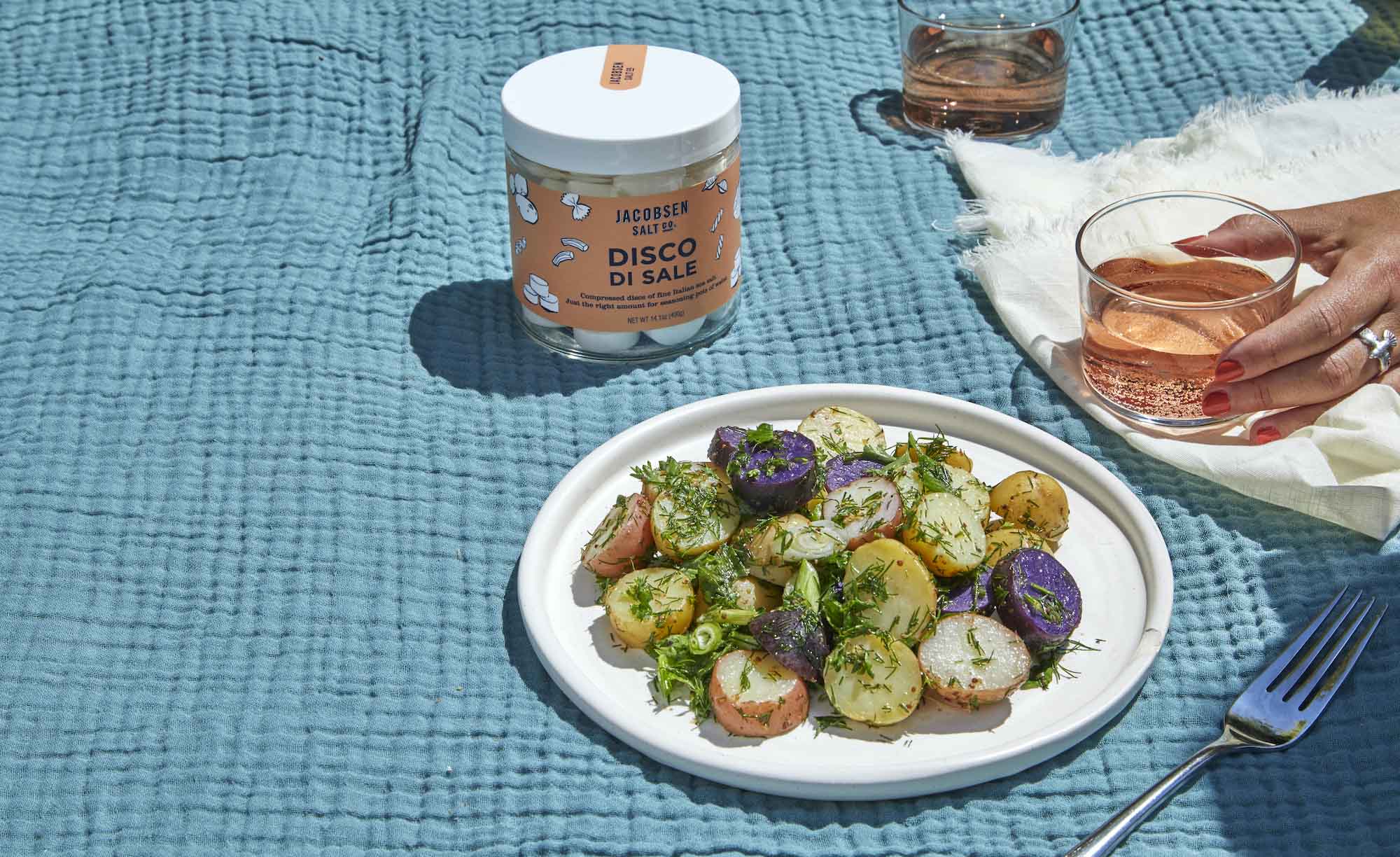 A plate of potato salad, a jar of 