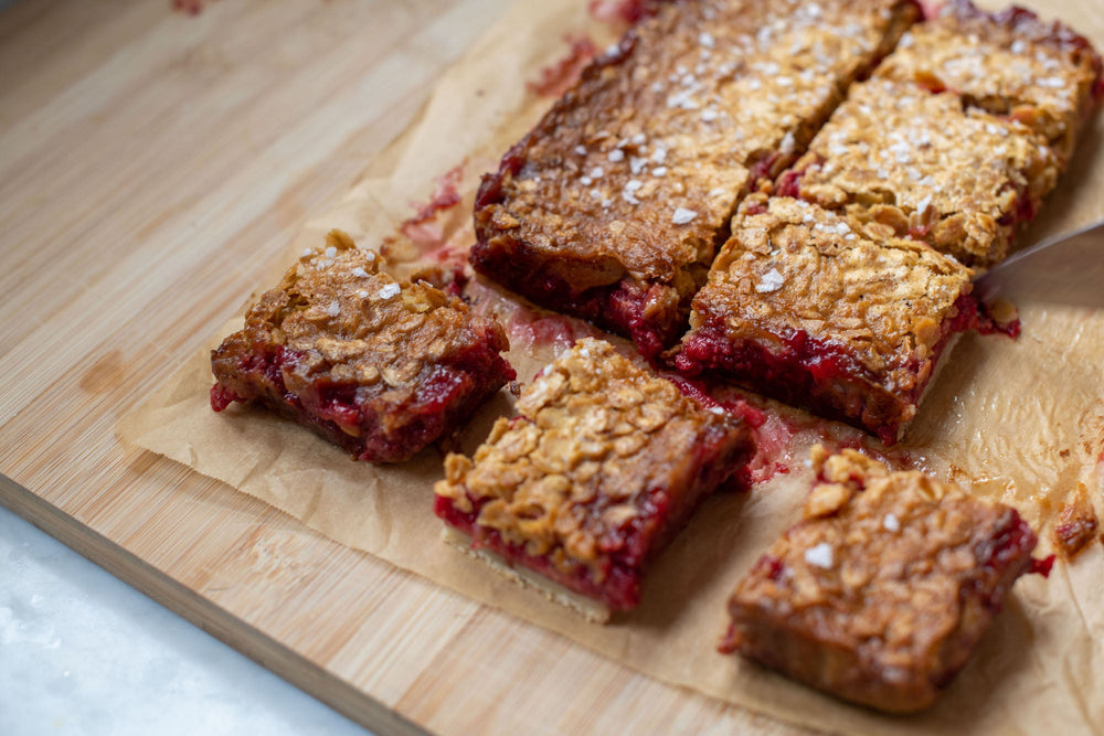 Slices of honey oat bars on a cutting board.