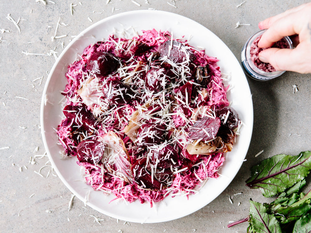 Plate of radicchio salad, being sprinkled with Pinot Noir Salt