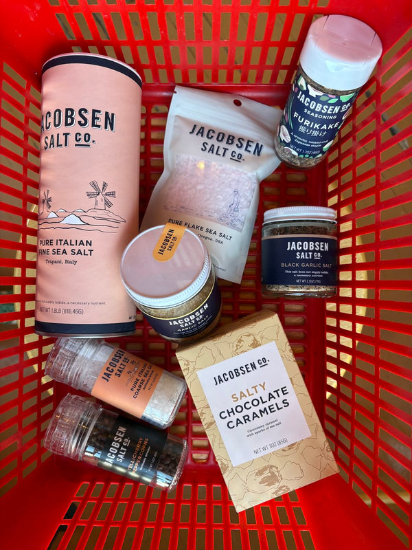 Red shopping basket with Jacobsen Salt Co. products