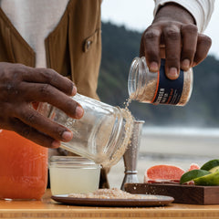 Habanero Salt being used to rim a glass for a margarita. 