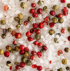 Close up of Jacobsen Coarse Sea Salt mixed with pink and green peppercorns. 