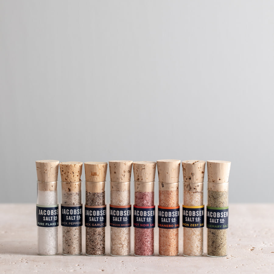 Eight vials of Jacobsen Infused Sea Salt, including Pure Flake, Black Pepper, Black Garlic, Cherrywood Smoked, Pinot Noir, Habanero, Lemon Zest and Rosemary