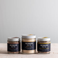 Jacobsen Salt Co bundle, including jars of Black Garlic Salt, Garlic Salt and Black Garlic Ginger Salt.