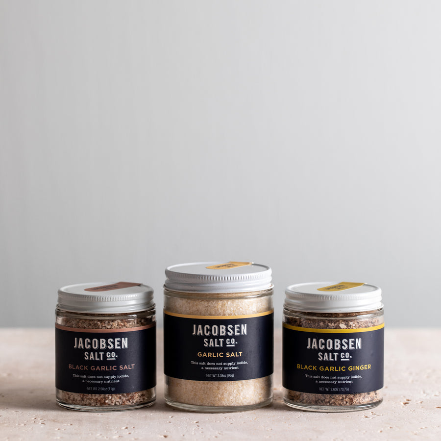 Jacobsen Salt Co bundle, including jars of Black Garlic Salt, Garlic Salt and Black Garlic Ginger Salt.
