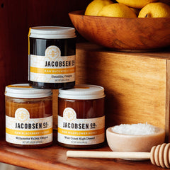 Jacobsen Raw Blackberry, Buckwheat and Wildflower honey on pantry shelf next to salt cellar