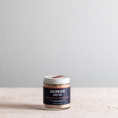 A 2.39 oz jar of Jacobsen Infused Cherrywood Smoked Salt. 