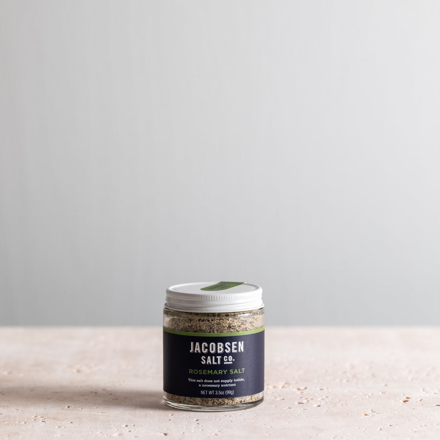 A 3.5 oz jar of Jacobsen Infused Rosemary Salt.