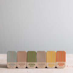 Six Jacobsen Salt slide tins, including Flake, Black Garlic, Rosemary, Black Pepper, Lemon Zest and Habanero