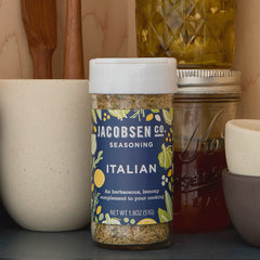 Jar of Jacobsen Italian Seasoning on pantry shelf.