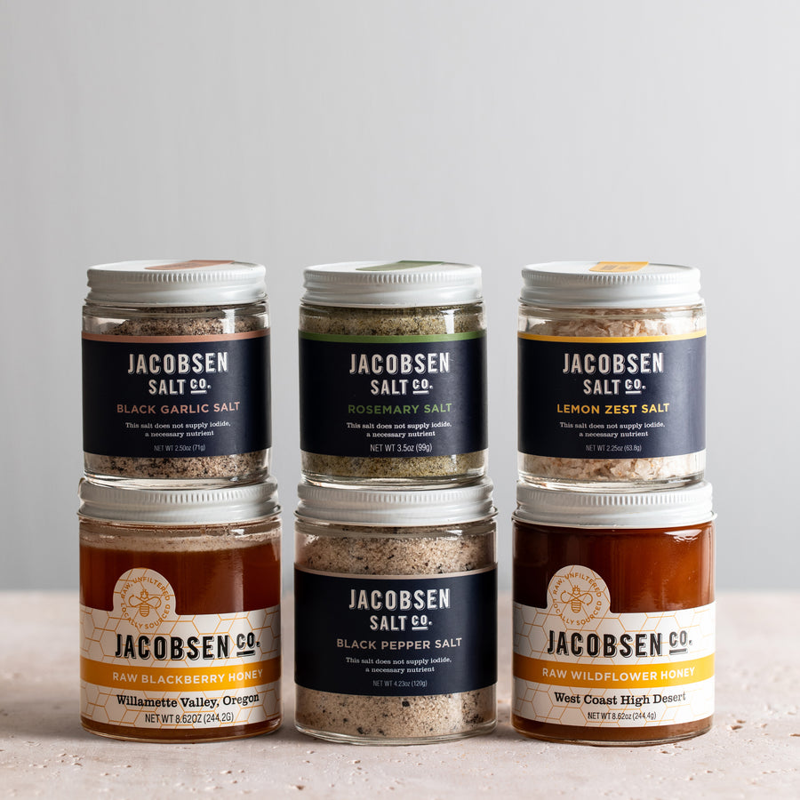 Jacobsen Salt Co. bundle including Infused Black Garlic Salt, Infused Rosemary Salt, Infused Lemon Zest Salt, Raw Blackberry Honey, Infused Black Pepper Salt and Raw Wildflower Honey