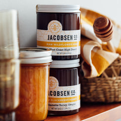 Jacobsen Raw Wildflower Honey and Raw Blackberry Honey on pantry shelf.