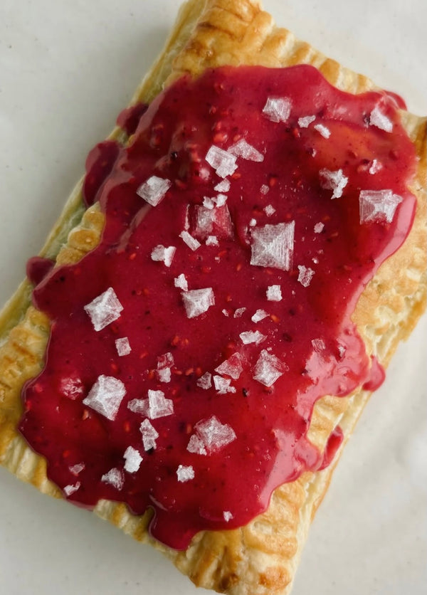 Hand pie with raspberry frosting and Flake Salt