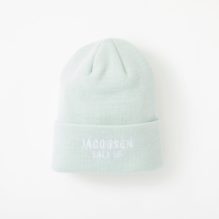 A sea foam beanie with white Jacobsen Salt Co logo on the front